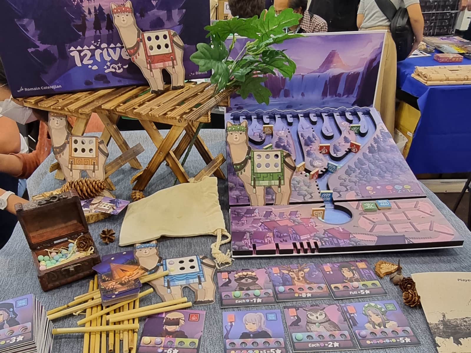 Vorstellung des Spiels 12 Rivers. Das Spielbrett ist eine Murmelbahn und die Spielersteine die Murmeln darin.