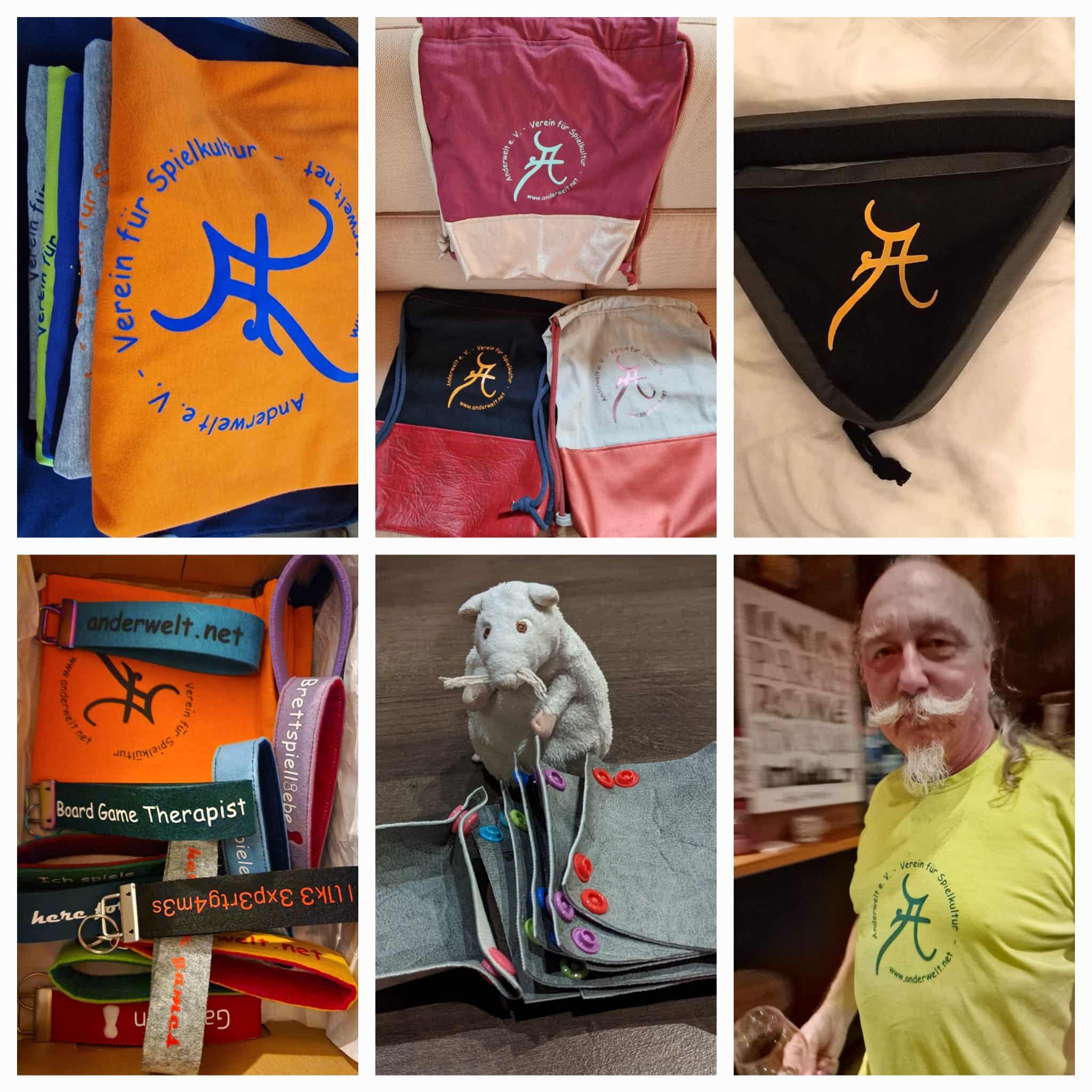 Zusammenschnitt aus mehreren Bildern. Gezeigt sind Shirts mit rundem Anderwelt-Aufdruck in bunten Farben, Rücksäcke mit rundem Anderwelt-Aufdruck, bunte Schlüsselbänder, eine schwarze Fahrradtasche mit orangefarbenen Anderwelt-A, Stoff-Schalen zum Zusammenklicken für Spielmaterial.