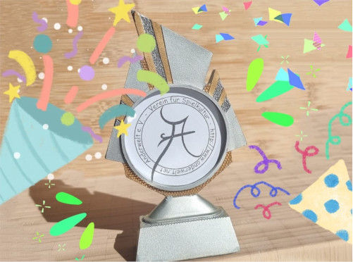 Anderwelt-Pokal mit Konfetti.
