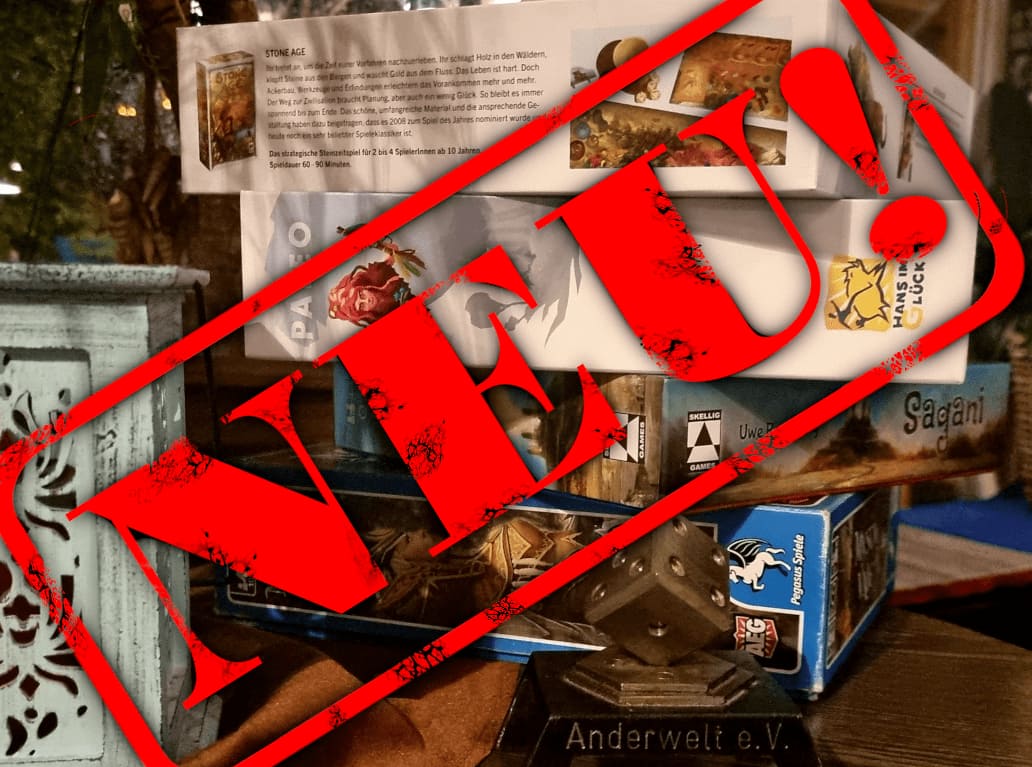 Aufgestapelte Spiele-Kartons mit einem großen NEU-Schriftzug davor.
